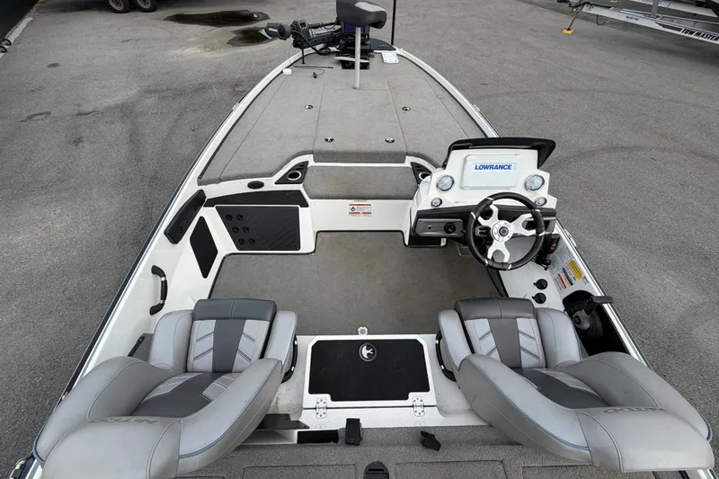 Slide: The Image of 2024 Nitro Z20 boat interior with steering console and seating, featuring Lowrance electronics. - 16