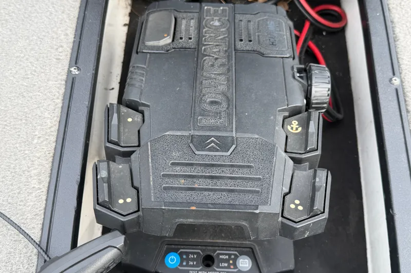Slide: The Image of Lowrance device in Nitro Z20 boat, 2024 model, with control buttons and wiring. - 44