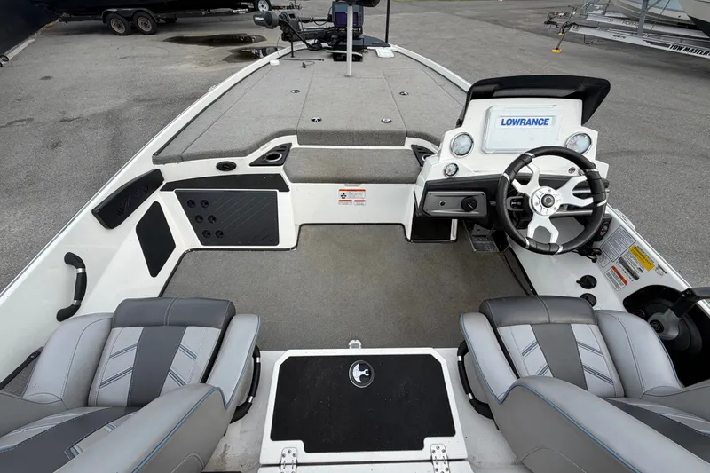 Slide: The Image of 2024 Nitro Z20 boat interior with steering wheel, seats, and Lowrance electronics. - 17