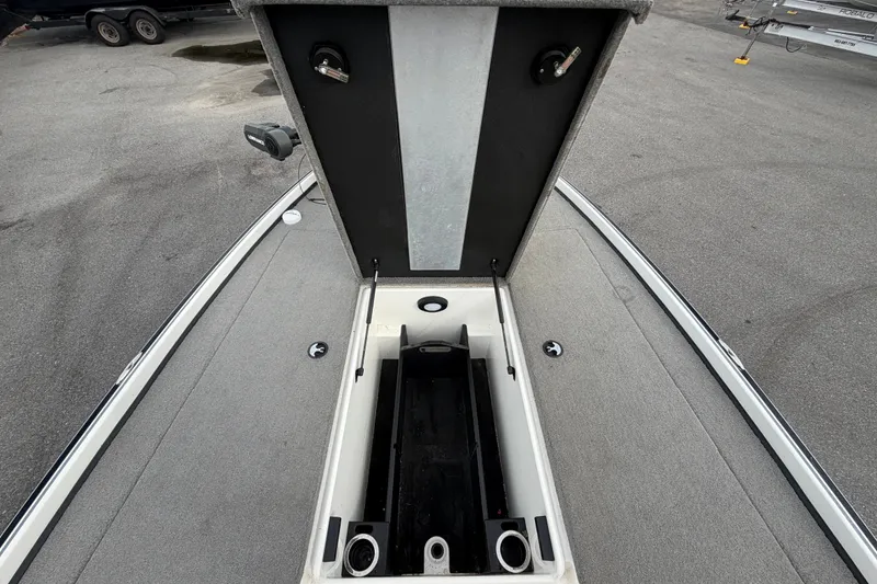Slide: The Image of 2024 Nitro Z20 boat storage compartment with open lid, showcasing spacious interior design. - 34