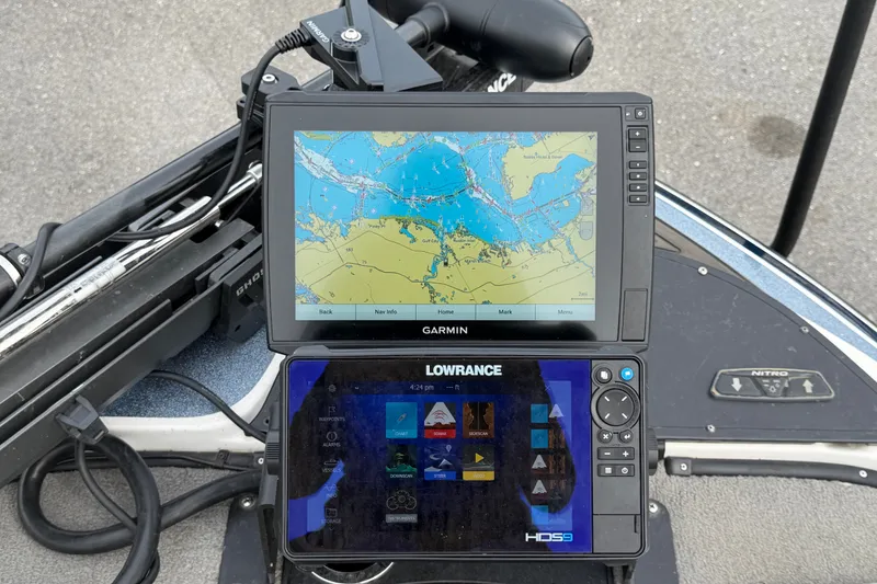 Slide: The Image of Boat dashboard with Garmin and Lowrance navigation systems on a 2024 Nitro Z20. - 43
