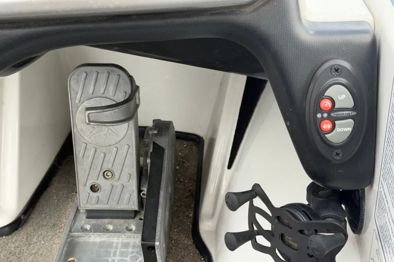 Slide: The Image of 2024 Nitro Z20 boat pedal and control panel with up and down buttons. - 25