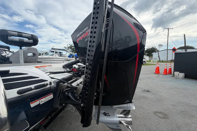 Slide: The Image of 2024 Nitro Z20 boat with Mercury Pro 250 engine, parked outdoors. - 7