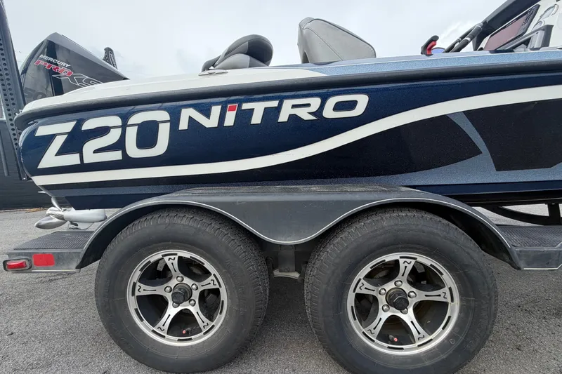Slide: The Image of 2024 Nitro Z20 boat on trailer, showcasing sleek design and branding. - 87