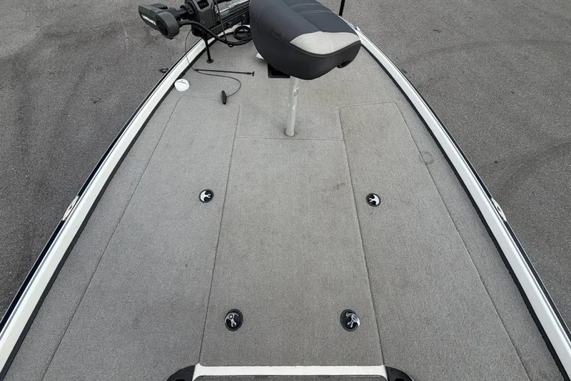 Slide: The Image of The image shows the deck of a 2024 Nitro Z20 boat with a seat and controls. - 35