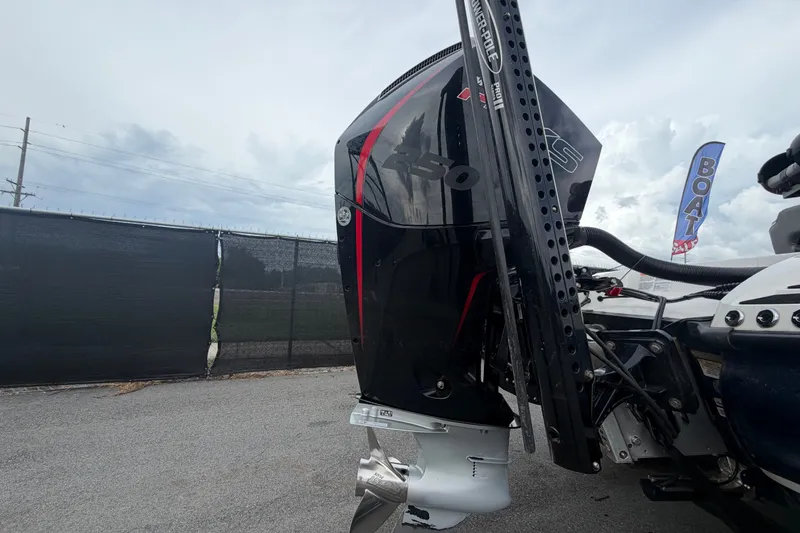 Slide: The Image of 2024 Nitro Z20 boat engine with sleek black and red design, parked outdoors. - 6