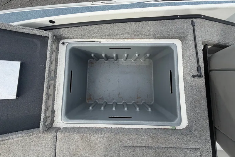 Slide: The Image of Open storage compartment in 2024 Nitro Z20 boat, featuring a spacious interior. - 71