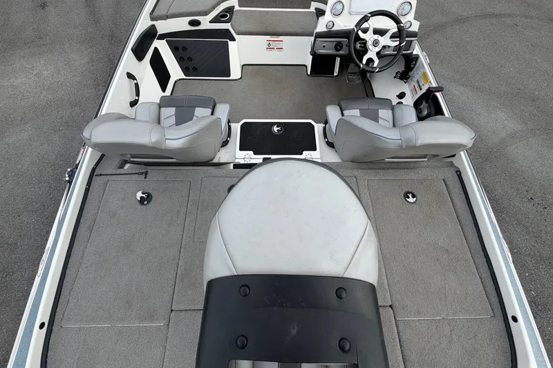 Slide: The Image of The image shows the cockpit of a 2024 Nitro Z20 boat with gray seats and a helm. - 15