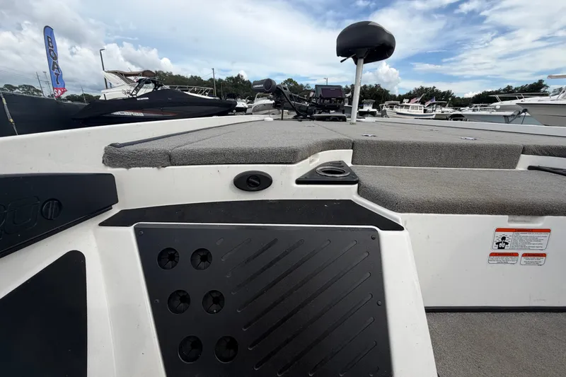 Slide: The Image of 2024 Nitro Z20 boat deck with seating and control panel, docked at marina. - 31