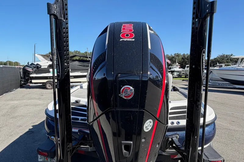 Slide: The Image of 2024 Nitro Z20 boat with powerful engine, parked outdoors on a sunny day. - 4