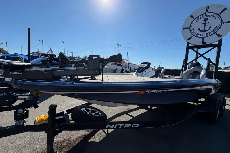 Slide: The Image of 2024 Nitro Z20 boat on trailer at dealership, sunny day, Lowrance equipment visible. - 10