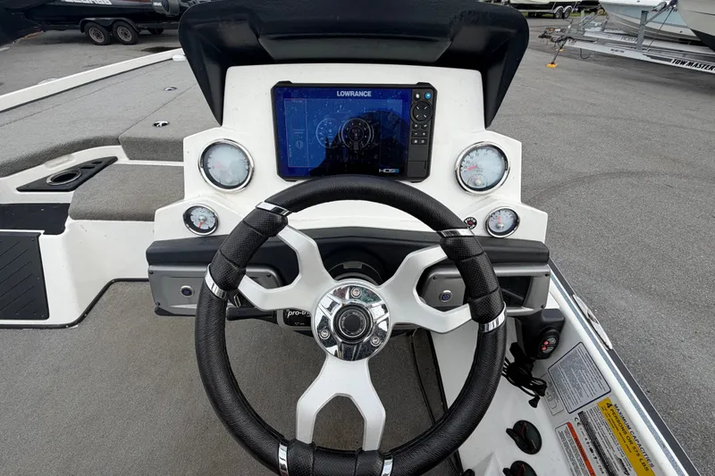 Slide: The Image of 2024 Nitro Z20 boat dashboard with steering wheel and digital display. - 20