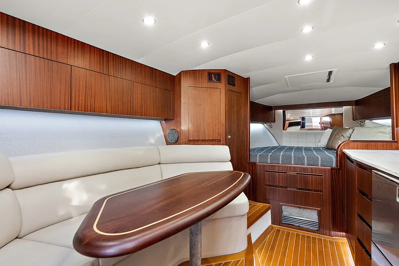 Slide: The Image of Luxurious interior of 2021 Jupiter 41 SB yacht with elegant wood finishes and cozy seating. - 18