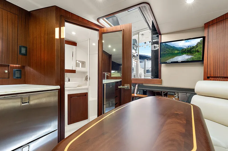 Slide: The Image of Luxurious interior of 2021 Jupiter 41 SB yacht with wood finishes and modern amenities. - 16