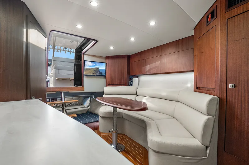 Slide: The Image of Luxurious interior of 2021 Jupiter 41 SB yacht with elegant seating and wooden finishes. - 17