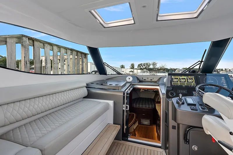 Slide: The Image of Interior of 2021 Jupiter 41 SB yacht with modern helm and seating area. - 13