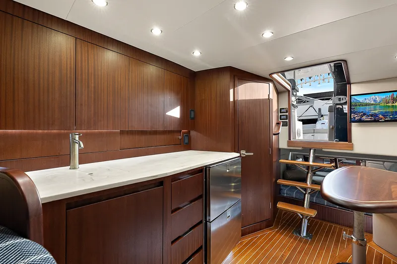 Slide: The Image of Luxurious interior of 2021 Jupiter 41 SB yacht with modern wood finishes and sleek design. - 19