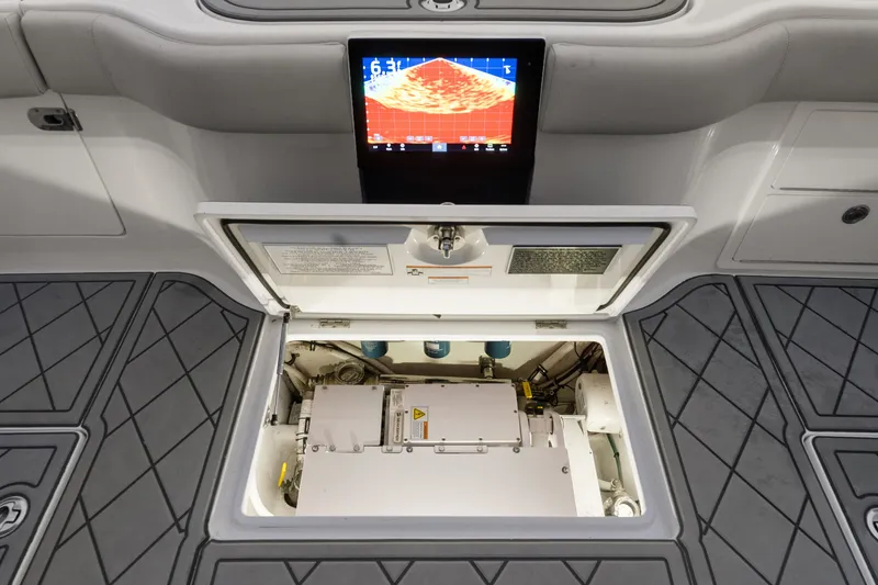 Slide: The Image of 2021 Jupiter 41 SB boat interior with open hatch and electronic display. - 23