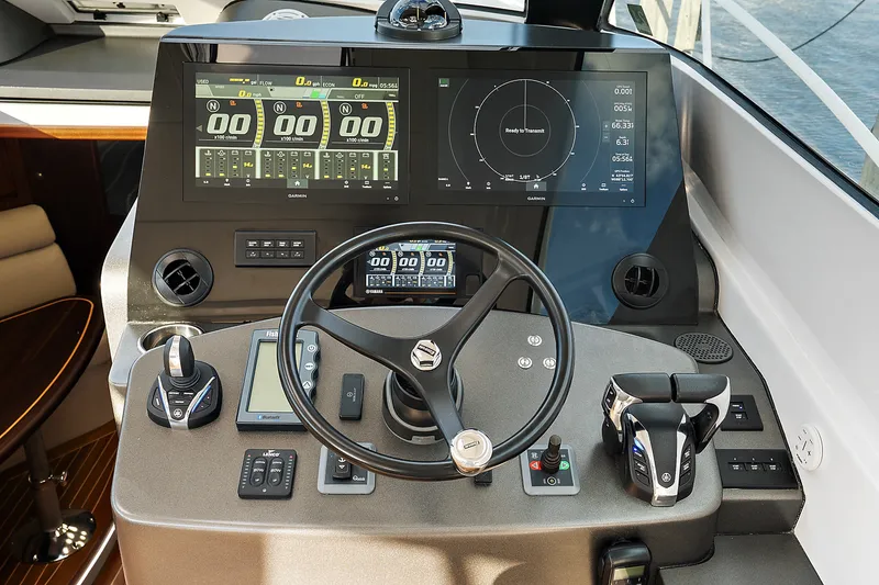 Slide: The Image of Helm of 2021 Jupiter 41 SB boat with advanced navigation and control systems. - 15