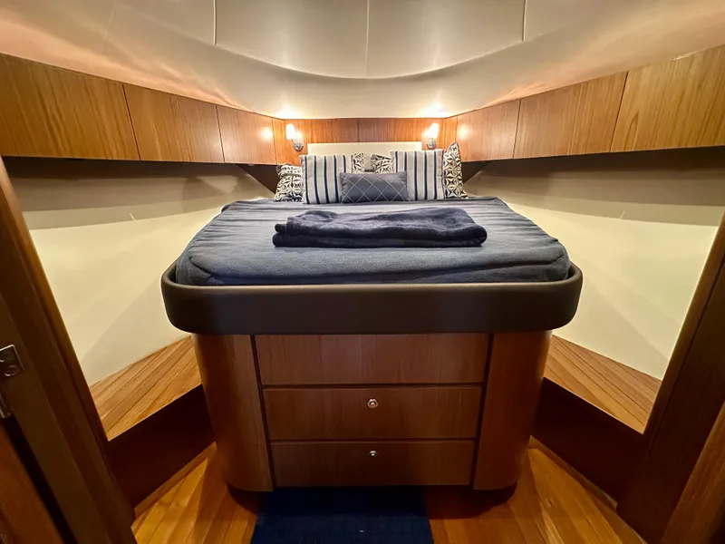 Slide: The Image of 2018 Tiara Yachts 4300 Open cabin with cozy bed and wooden interior. - 32