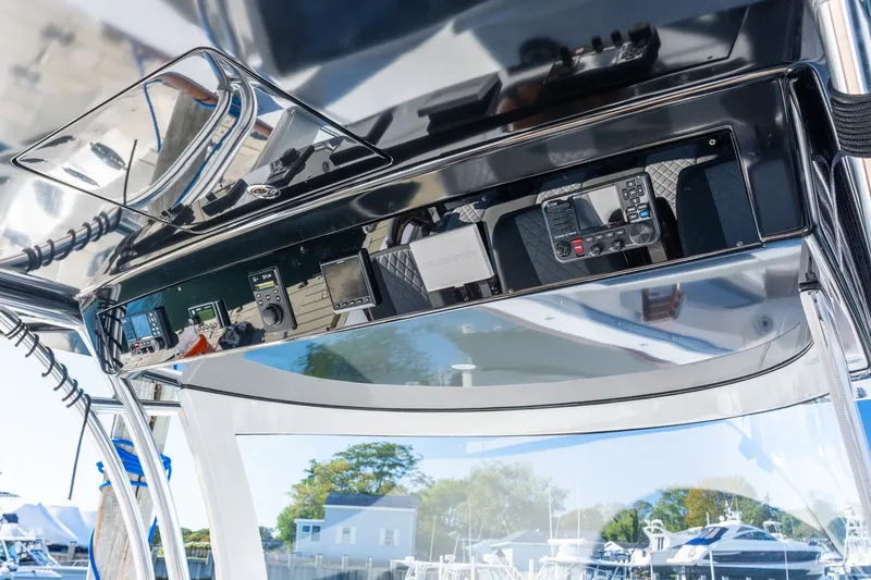 Slide: The Image of 2022 Valhalla V-46 boat dashboard with advanced navigation and control systems. - 34