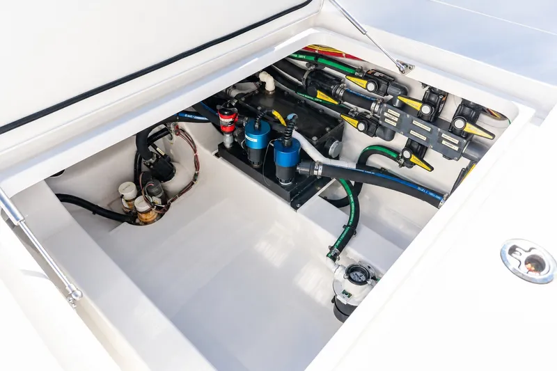 Slide: The Image of 2022 Valhalla V-46 boat engine compartment with visible wiring and components. - 12