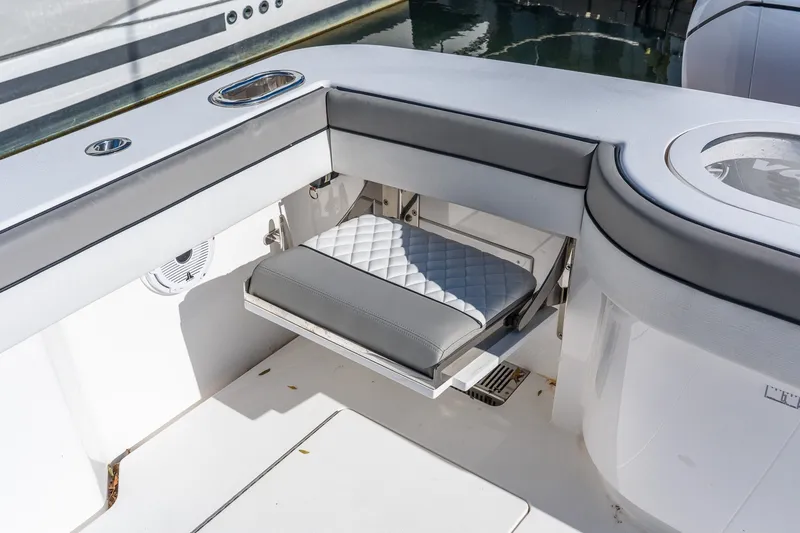 Slide: The Image of 2022 Valhalla V-46 boat interior with fold-out seat and sleek design. - 7