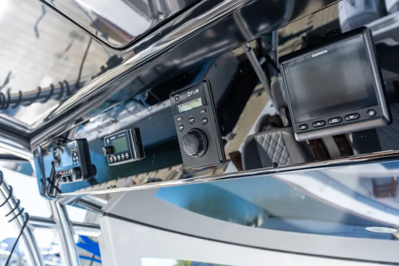Slide: The Image of 2022 Valhalla V-46 boat dashboard with advanced navigation and control systems. - 33