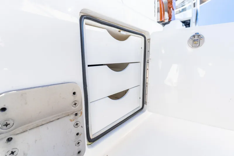 Slide: The Image of Storage compartment with drawers on a 2022 Valhalla V-46 boat. - 10