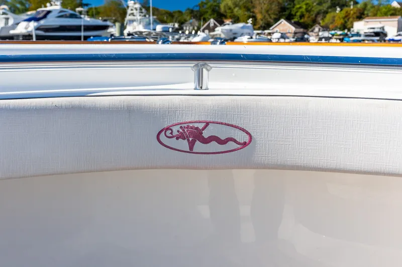 Slide: The Image of 2022 Valhalla V-46 boat interior with logo, docked at a marina. - 52