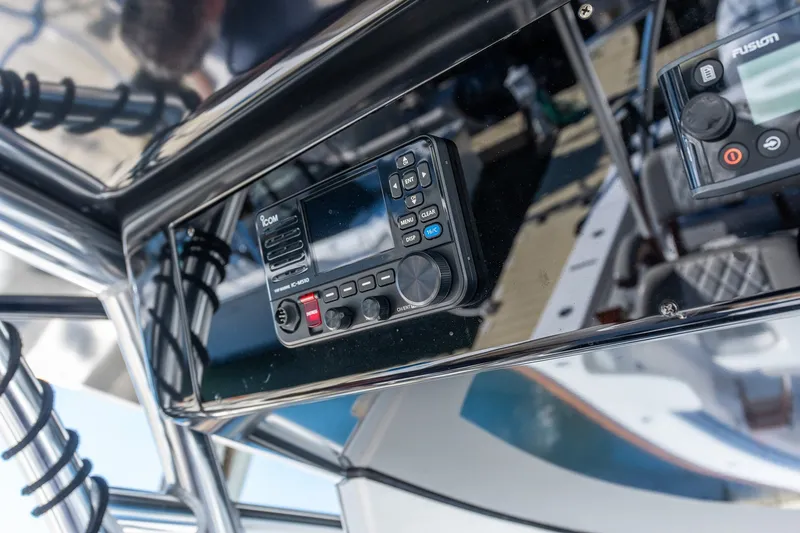 Slide: The Image of Control panel of 2022 Valhalla V-46 boat featuring Icom and Fusion devices. - 32