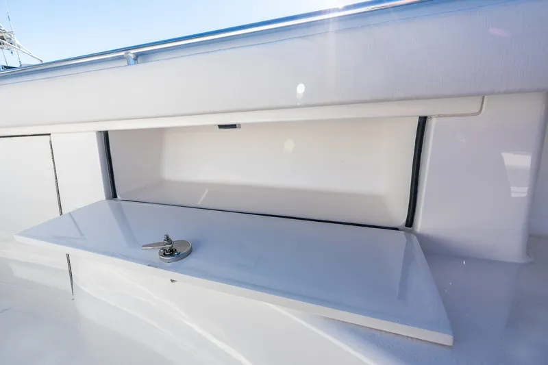Slide: The Image of 2022 Valhalla V-46 boat storage compartment with open hatch and secure latch. - 50