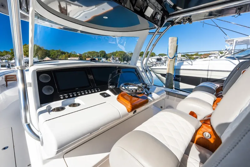 Slide: The Image of Interior of 2022 Valhalla V-46 boat with modern dashboard and luxurious seating. - 28