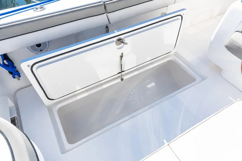 Slide: The Image of Open storage compartment on 2022 Valhalla V-46 boat deck. - 57