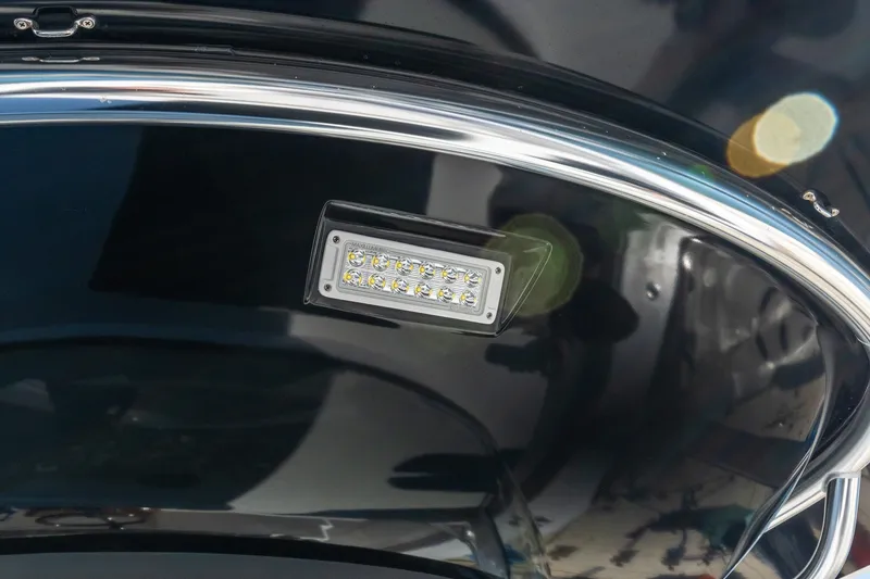Slide: The Image of LED light fixture on 2022 Valhalla V-46 boat's polished interior surface. - 35