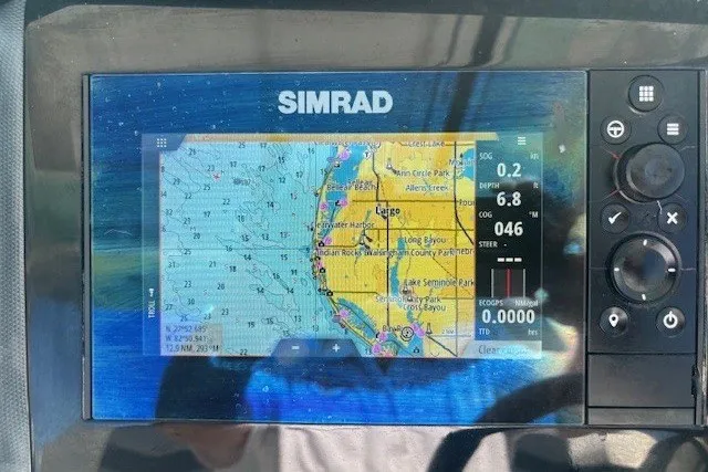 Slide: The Image of Simrad navigation display on 2021 Chaparral 280 OSX boat, showing coastal map and data. - 19