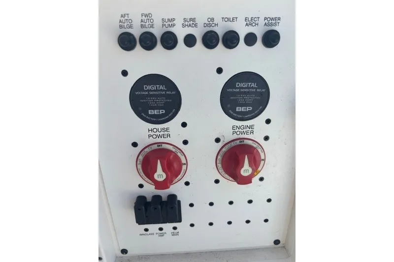 Slide: The Image of Control panel of a 2021 Chaparral 280 OSX boat with power switches and digital relays. - 43