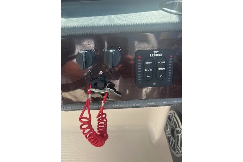 Slide: The Image of Control panel of 2021 Chaparral 280 OSX boat with Lenco trim tab switches. - 23