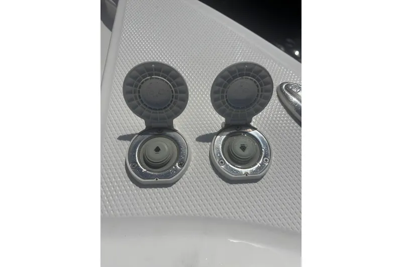 Slide: The Image of Fuel caps on 2021 Chaparral 280 OSX boat deck, open and exposed. - 14