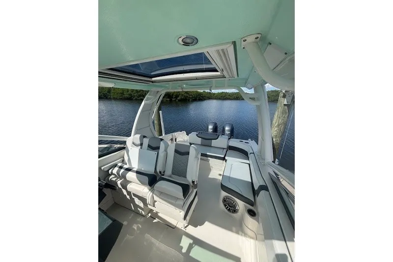 Slide: The Image of 2021 Chaparral 280 OSX boat interior with seating, open water view. - 28