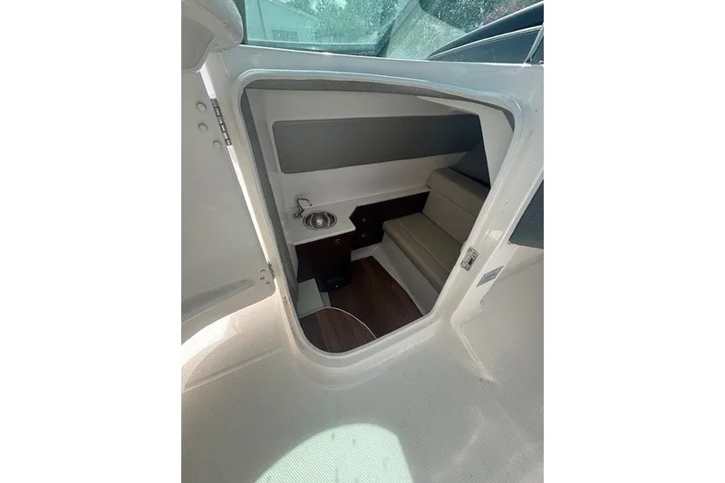 Slide: The Image of Interior cabin of 2021 Chaparral 280 OSX boat with seating and sink. - 30