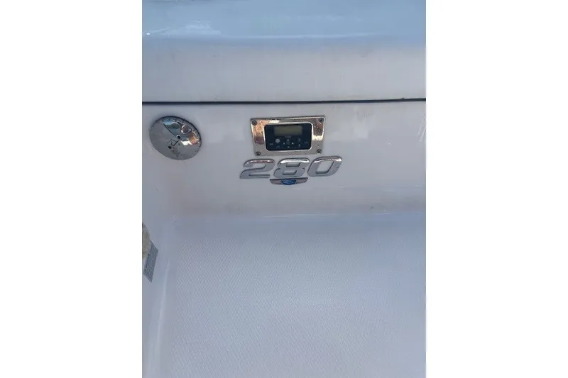 Slide: The Image of 2021 Chaparral 280 OSX boat emblem and control panel detail. - 38