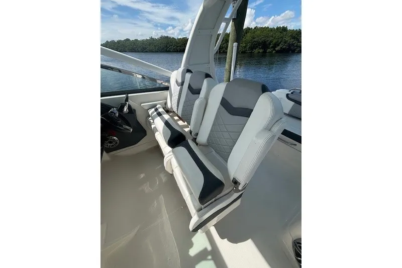 Slide: The Image of 2021 Chaparral 280 OSX boat interior with stylish seating and scenic water view. - 27