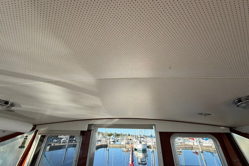Slide: The Image of Interior view of 1973 Chris-Craft 31 Sedan Cruiser with marina in background. - 61