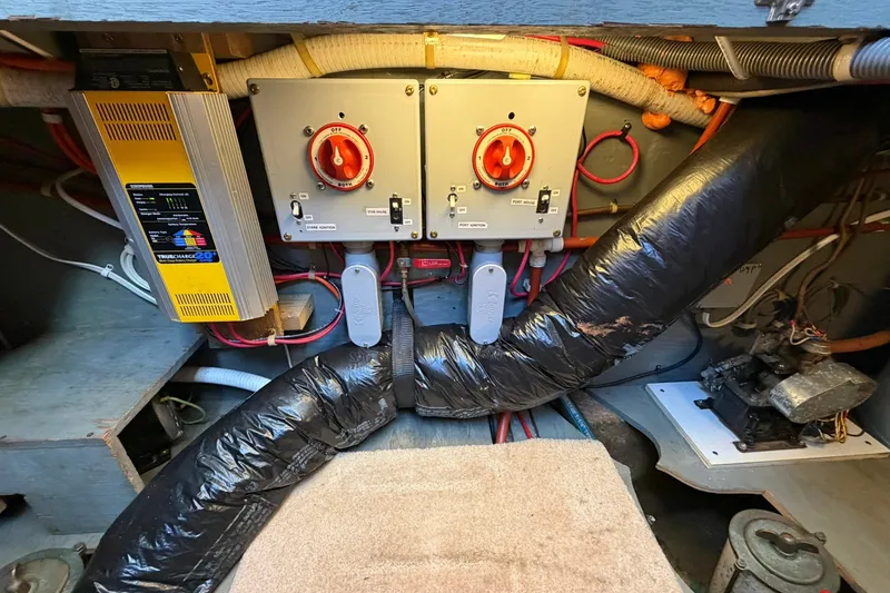 Slide: The Image of Electrical system of a 1973 Chris-Craft 31 Sedan Cruiser with wiring and control panels. - 65