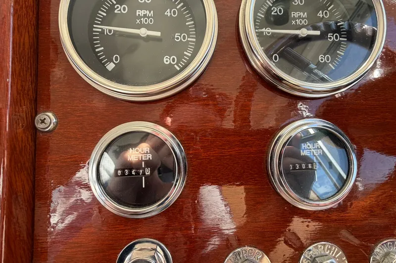 Slide: The Image of 1973 Chris-Craft 31 Sedan Cruiser dashboard with RPM gauges and hour meters. - 43