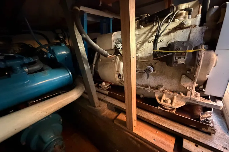 Slide: The Image of Engine room of a 1973 Chris-Craft 31 Sedan Cruiser with visible machinery components. - 22