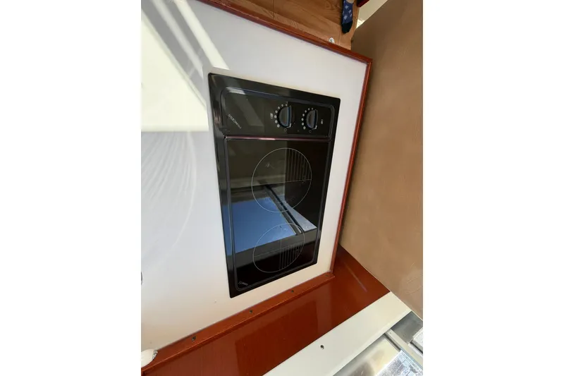 Slide: The Image of Stovetop in 1973 Chris-Craft 31 Sedan Cruiser kitchen area, featuring modern design elements. - 63