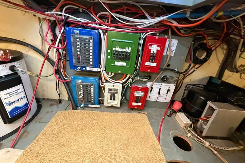 Slide: The Image of Electrical panel and wiring inside a 1973 Chris-Craft 31 Sedan Cruiser boat. - 68