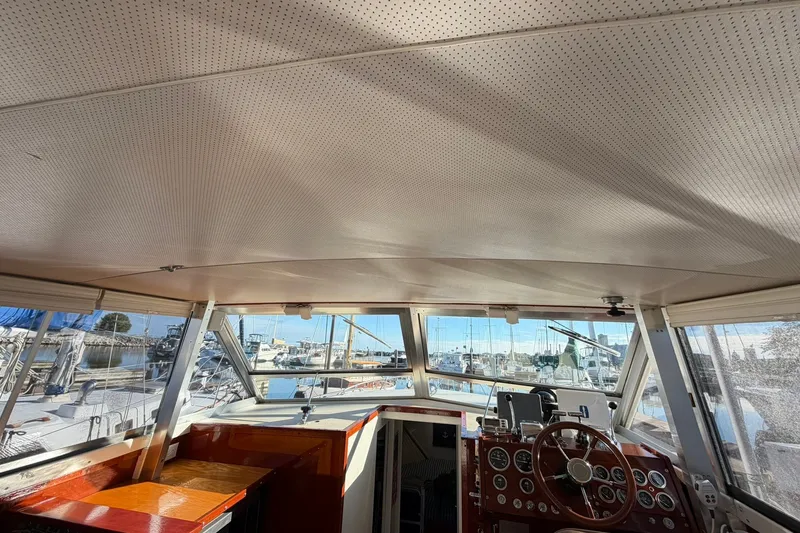 Slide: The Image of Interior view of a 1973 Chris-Craft 31 Sedan Cruiser, showcasing helm and dashboard. - 62